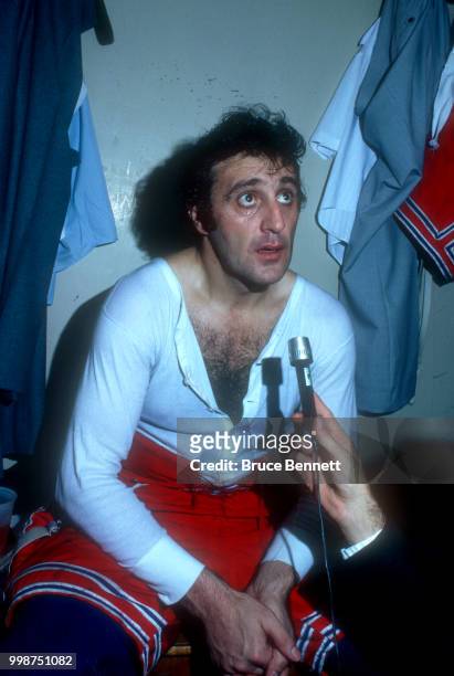 Phil Esposito of the New York Rangers sits in the locker room after an NHL game against the California Golden Seals circa 1975 at the Oakland...