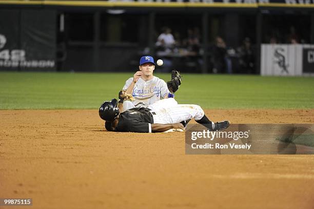 Juan Pierre of the Chicago White Sox steals second base as Chris Getz of the Kansas City Royals cannot catch the ball on May 03, 2010 at U.S....