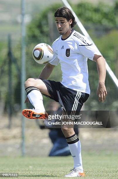 Germany's midfielder Sami Khedira warms up with the ball during a training session at the Verdura Golf and Spa resort, near Sciacca May 16, 2010. The...