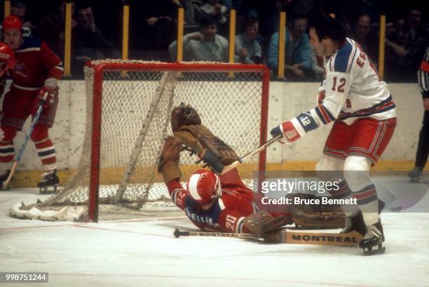 Phil Esposito of the New York Rangers tries to score as goalie Vladislav Tretiak of HC CSKA Moscow makes the sprawling save during an exhibition game...