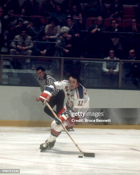 Phil Esposito of the New York Rangers skates on the ice with the puck during an NHL game circa January, 1976 at the Madison Square Garden in New...