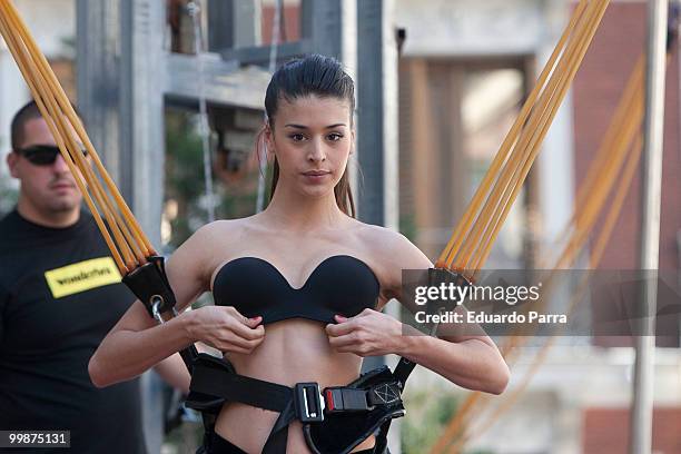 Model wearing the bra 'Perfect Strapless, designed by Wonderbra, jump on a trampoline to test the effectiveness of the new item of clothing at El...