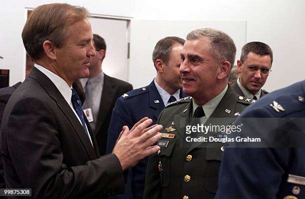 Ranking member Chet Edwards, D-TX., talks with Gen. John Abizaid - commander, U.S. Central Command before the start fo the military construction...