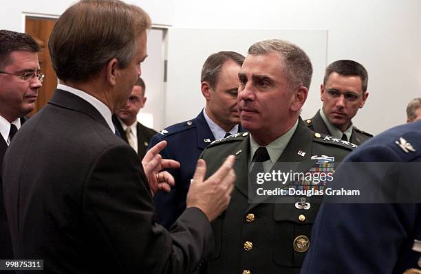 Ranking member Chet Edwards, D-TX., talks with Gen. John Abizaid - commander, U.S. Central Command before the start fo the military construction...