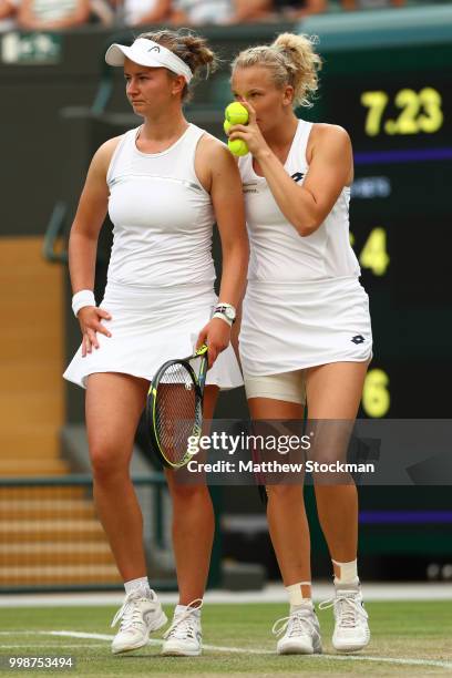 Barbora Krejcikova and Katerina Siniakova of Czech Republic discuss tactics during the Ladies' Doubles final against Nicole Melichar of The United...