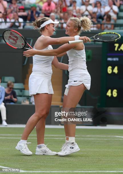 Czech Republic's Barbora Krejcikova and Czech Republic's Katerina Siniakova reacts after winning against Nicole Melichar of the USA and Czech...