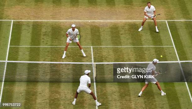South Africa's Raven Klaasen and New Zealand's Michael Venus play against US player Mike Bryan and US player Jack Sock during their mens' doubles...