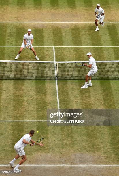 South Africa's Raven Klaasen and New Zealand's Michael Venus play against US player Mike Bryan and US player Jack Sock during their mens' doubles...