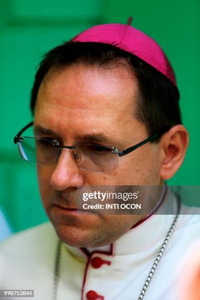 Papal nuncio Waldemar Stanislaw accompanies Nicaraguan Cardinal Leopoldo Brenes as he speaks to the press after students of the National Autonomous...