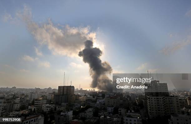 Smoke rises after Israeli fighter jets pounded a building in Al Katiba region in Gaza City, Gaza on July 14, 2018.