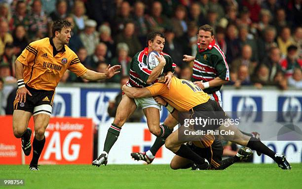 Mike Tindall of Bath tries to tackle Steve Booth of Leicester Tigers during the Zurich Premiership match between Leicester Tigers and Bath at Welford...