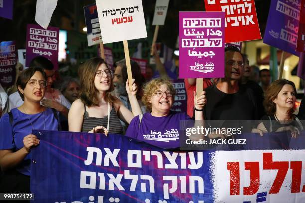 Demonstrators attend a rally to protest against the 'Jewish Nation-State Bill' in the Israeli coastal city of Tel Aviv on July 14, 2018. - The Jewish...