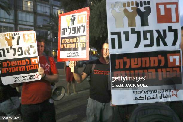 Demonstrators attend a rally to protest against the 'Jewish Nation-State Bill' in the Israeli coastal city of Tel Aviv on July 14, 2018. - The Jewish...