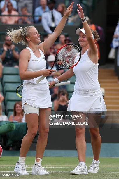 Czech Republic's Barbora Krejcikova and Czech Republic's Katerina Siniakova react after winning against Nicole Melichar of the USA and Czech...