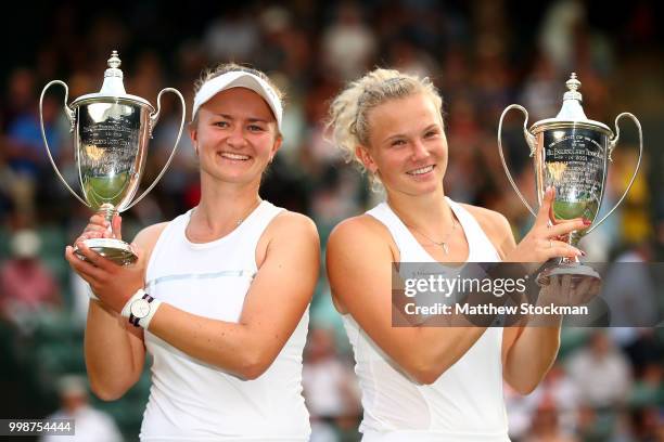 Winners Barbora Krejcikova and Katerina Siniakova of Czech Republic pose with their trophies after their victory against Nicole Melichar of The...