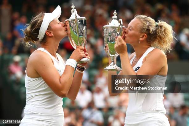 Winners Barbora Krejcikova and Katerina Siniakova of Czech Republic pose with their trophies after their victory against Nicole Melichar of The...