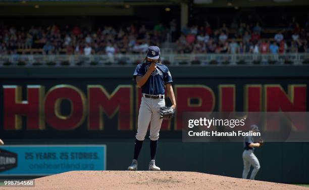 Chris Archer of the Tampa Bay Rays reacts to giving up a solo home run to Max Kepler of the Minnesota Twins during the second inning of the game on...