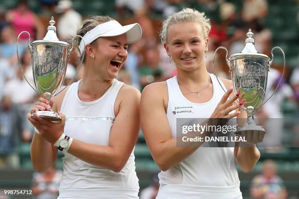 Czech Republic's Barbora Krejcikova and Czech Republic's Katerina Siniakova pose with their trophies after winning their ladies' doubles final match...