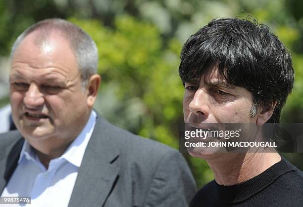 Germany's head coach Joachim Loew and DFB spokesman Harald Stenger address a press conference at the Verdura Golf and Spa resort, near Sciacca May 17...