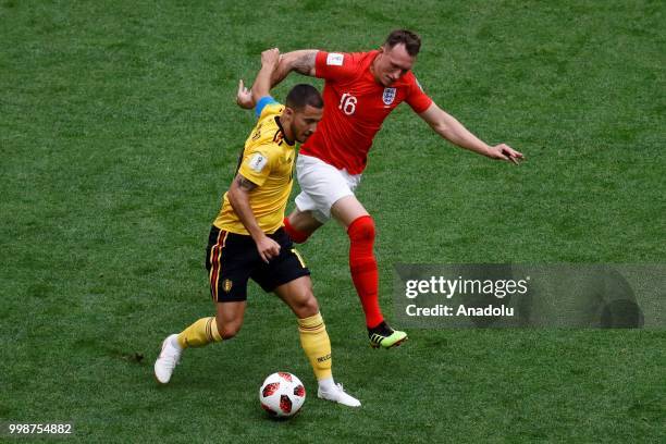 Eden Hazard of Belgium and Phil Jones of England vie for the ball during the 2018 FIFA World Cup 3rd place match between Belgium and England at the...