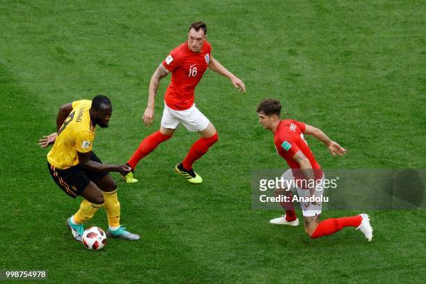 Romelu Lukaku of Belgium and John Stones of England vie for the ball during the 2018 FIFA World Cup 3rd place match between Belgium and England at...
