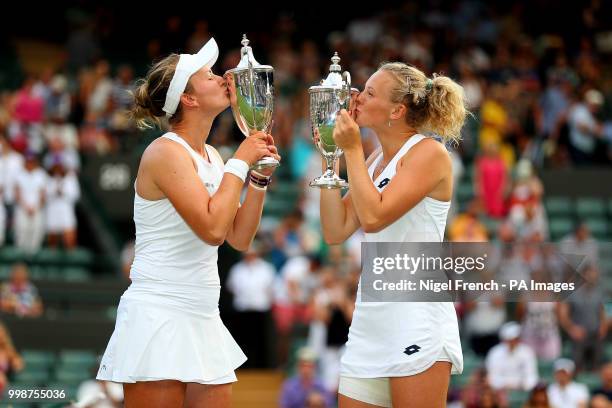 Katerina Siniakova and Barbora Krejcikova with their trophies after winning the Ladies Doubles on day twelve of the Wimbledon Championships at the...