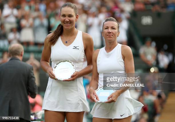 Nicole Melichar of the USA and Czech Republic's Kveta Peschke pose with their runner's up trophies after losing their ladies' doubles final match to...
