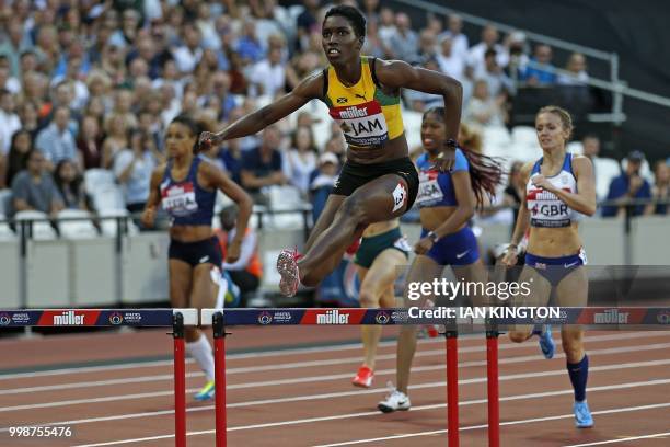 Jamaica's Janieve Russell clears the final hurdle on her way to winning the women's 400m hurdles during the Athletics World Cup team competition at...