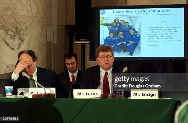 Peter Fitzgerald, R-IL,and Frank D Lucas, R-OK., listen to Sean O'Keefe, administrator, NASA, during emotional testimony at the Senate Commerce,...