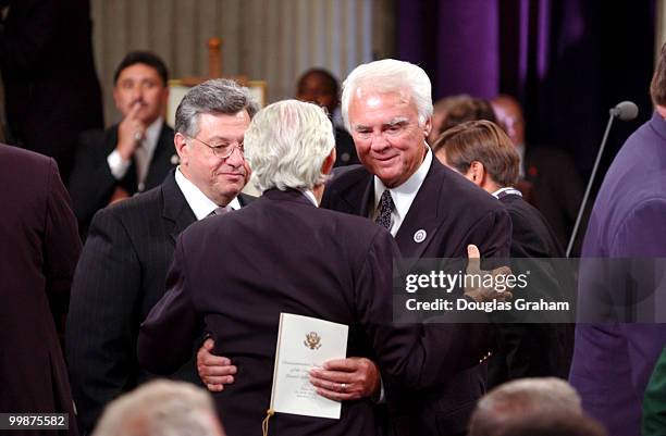 Benjamin A. Gilman, R-NY and C.W. Young, R-FL., hug and greet each other before the start of the Commemorative Joint Meeting of Congress held at...