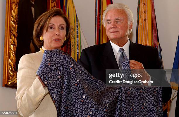 Nancy Pelosi, D-CA., and C.W. Young, R-FL., check out limited-edition ties and scarves in remembrance of September 11 attacks on the U.S. The ties...