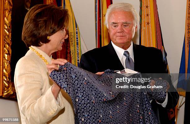 Nancy Pelosi, D-CA., and C.W. Young, R-FL., check out limited-edition ties and scarves in remembrance of September 11 attacks on the U.S. The ties...