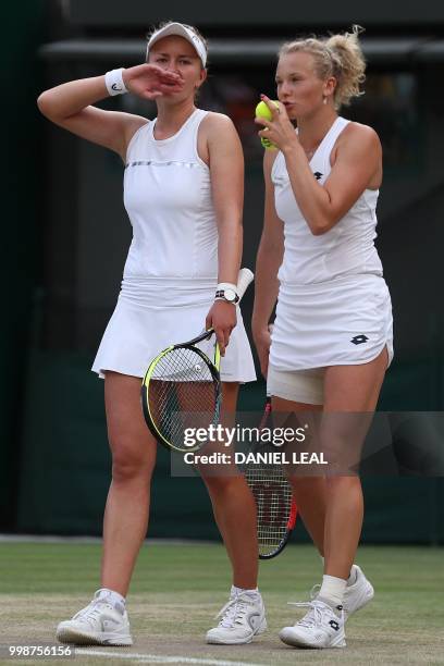 Czech Republic's Barbora Krejcikova and Czech Republic's Katerina Siniakova talk during their ladies' doubles final match their against Nicole...