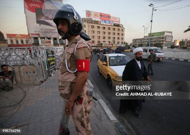 Members of the Iraqi security forces are deployed in the capital Baghdad's Tahrir Square during demonstrations against unemployment on July 14, 2018....