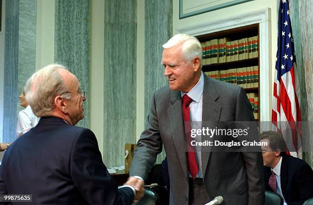 Rupert Murdoch, chairman/chief executive, News Corporation greets Ernest Fritz Hollings. D-S.C., before the start of the full committee hearing on...