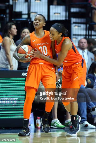 Connecticut Sun guard Jasmine Thomas and Connecticut Sun guard Courtney Williams celebrate during the closing second of the WNBA game between Phoenix...