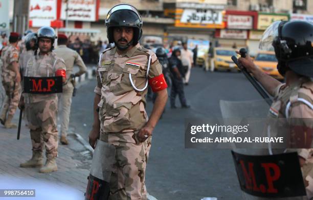 Members of the Iraqi security forces are deployed in the capital Baghdad's Tahrir Square during demonstrations against unemployment on July 14, 2018....