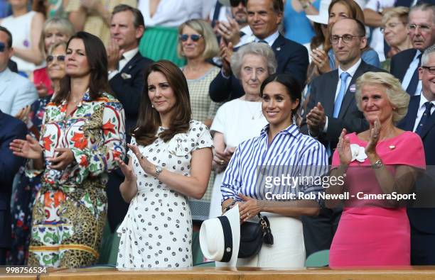 Catherine, Duchess of Cambridge and Meghan, Duchess of Sussex attend day twelve of the Wimbledon Tennis Championships at All England Lawn Tennis and...