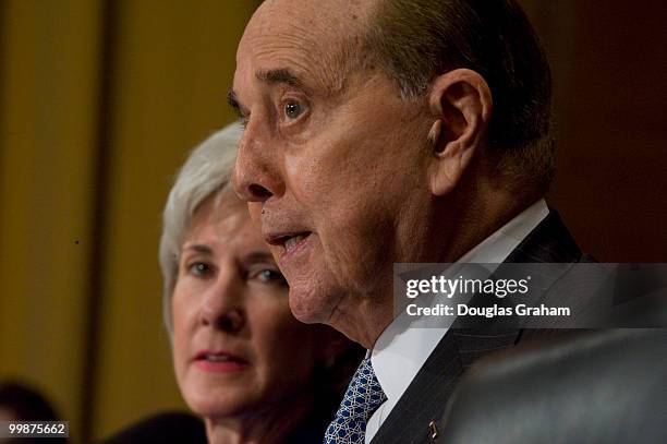 Gov. Kathleen Sebelius, D-Kan., listens to former senator Bob Dole as his testifies before the Senate Finance full committee hearing on the her...