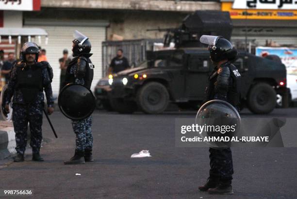 Members of the Iraqi security forces are deployed in the capital Baghdad's Tahrir Square during demonstrations against unemployment on July 14, 2018....