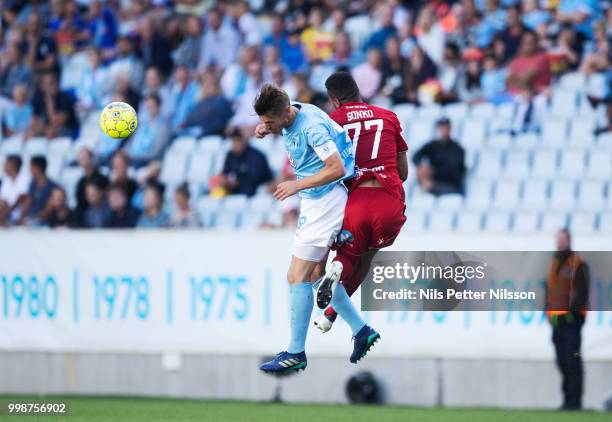 Markus Rosenberg of Malmo FF and Noah Sonko Sundberg of Ostersunds FK competes for the ball during the Allsvenskan match between Malmo FF and...