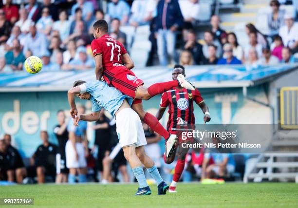 Markus Rosenberg of Malmo FF is tackled by Noah Sonko Sundberg of Ostersunds FK during the Allsvenskan match between Malmo FF and Ostersunds FK at...