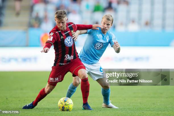 Dennis Widgren of Ostersunds FK and Oscar Lewicki of Malmo FF competes for the ball during the Allsvenskan match between Malmo FF and Ostersunds FK...