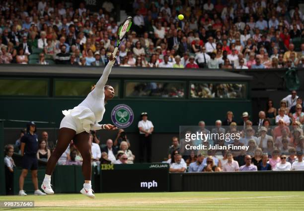 Serena Williams of The United States serves to Julia Goerges of Germany during their Ladies' Singles semi-final match on day ten of the Wimbledon...
