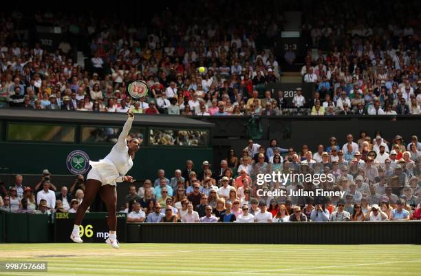 Serena Williams of The United States serves to Julia Goerges of Germany during their Ladies' Singles semi-final match on day ten of the Wimbledon...