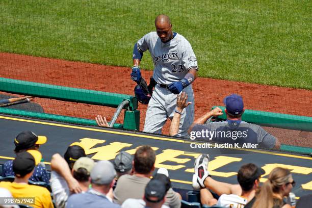 Keon Broxton of the Milwaukee Brewers celebrates after scoring on a RBI single in the fifth inning during game one of a doubleheader against the...