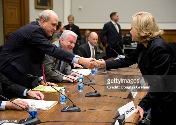 Jim Blaine, president of the North Carolina State Employees Credit Union greets Carolyn Maloney, D-NY, during the House Financial Services Committee...