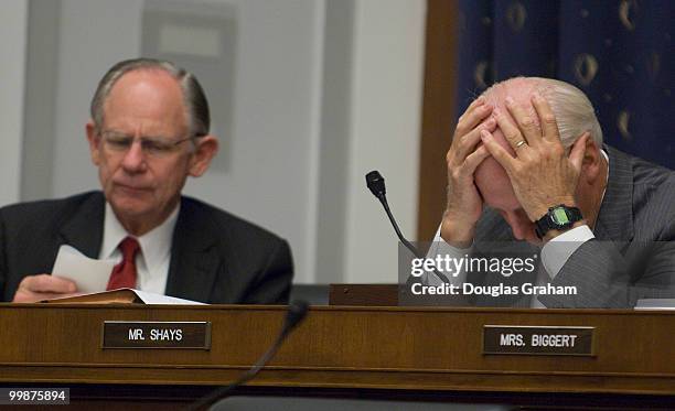 Michael Castle, R-DE and Christopher Shays, R-CT., grind through paper work at the House Financial Services Committee full committee hearing on...