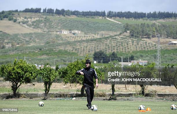 Germany's head coach Joachim Loew takes part in a training session at the Verdura Golf and Spa resort, near Sciacca on May 16, 2010. The German team...