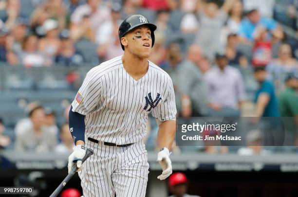 Aaron Judge of the New York Yankees watches his seventh inning home run against the Atlanta Braves at Yankee Stadium on July 4, 2018 in the Bronx...